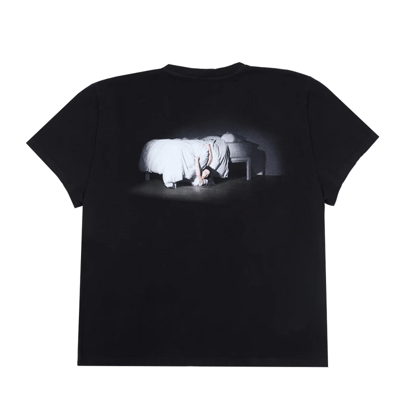 Back of the black Billie Eilish tee showing a continuation of the album art, with Billie crawling from under the bed in a white outfit. Dark and cinematic visual celebrating the WHEN WE ALL FALL ASLEEP, WHERE DO WE GO? album.
