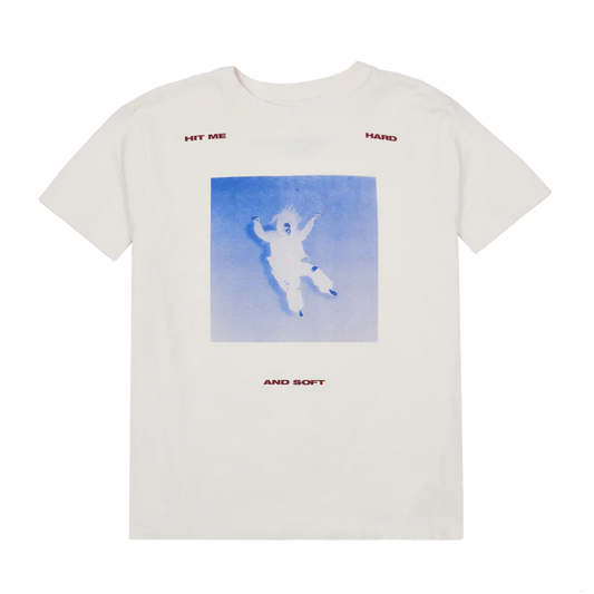 Front of Billie Eilish’s Falling Scatter Text white t-shirt featuring a blue-toned photo of Billie mid-air and red “HIT ME HARD AND SOFT” text scattered around the graphic. A dreamy and minimalist tee from the HIT ME HARD AND SOFT album drop.

