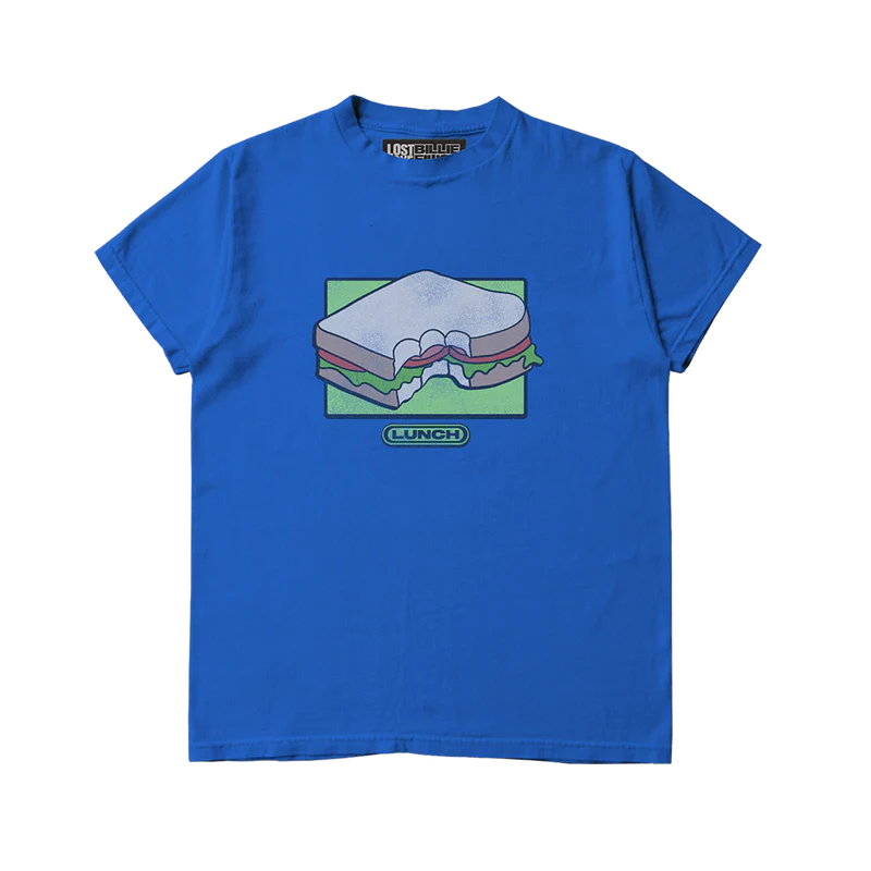 Bright blue Billie Eilish x Lost Love tee featuring a cartoon sandwich graphic with a bite taken out, set against a green background and labeled “LUNCH” underneath. Fun, vintage-style Billie Eilish merch made from sustainable, upcycled materials.

