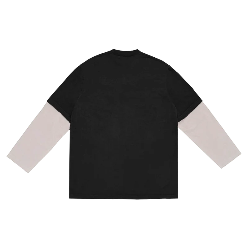 Back view of the Billie Eilish anniversary long sleeve tee in black with layered white sleeves, featuring a plain back design that emphasizes the striking front graphic. This dual-layer shirt is part of the WHEN WE ALL FALL ASLEEP, WHERE DO WE GO? album anniversary merch collection.

